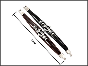 Detail of 21cm multilayer braided leather bracelets with silver anchor pendants