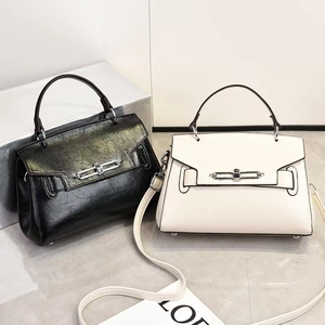 Detail of classic crossbody bags with vintage metal buckle and detachable long shoulder straps