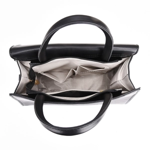 Top-down view of black PU handbag interior with herringbone lining and pockets