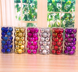 Detailed set of Christmas balls in six colors displayed on a wooden table for holiday decor