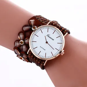 Detail view of Bohemian flower bracelet watch with sparkling rhinestones and suede strap