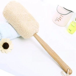 Detail of long wooden handle bath brush with natural bristles and hanging rope
