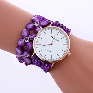 Detail of purple floral wrap-around watch featuring sparkling crystals and a rose gold case