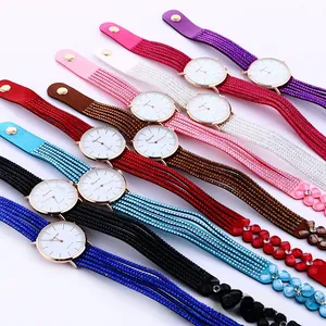 Close-up of rhinestone floral bracelets with quartz watch faces in multiple colors