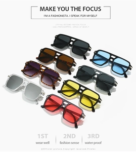 Detail of square double-bridge sunglasses showing reinforced metal hinges and color options