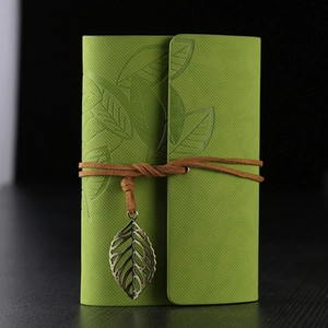Retro grass green leather notebook with leaf embossing and vintage metal leaf pendant