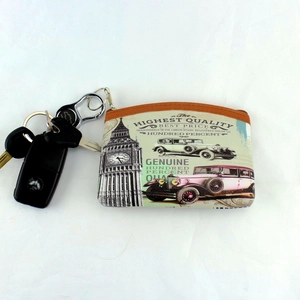 Macro shot of retro fabric coin purse featuring Big Ben print and metal keychain