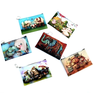 Detail view of colorful canvas coin purses with cute 3D elephant and cartoon animal prints
