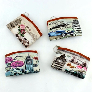 Detailed view of four vintage coin purses featuring Eiffel Tower and retro prints