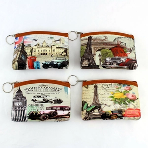 Set of four vintage coin purses featuring Eiffel Tower prints and bronze zipper details