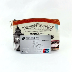 Detailed view of vintage coin purse with London print and card for size reference
