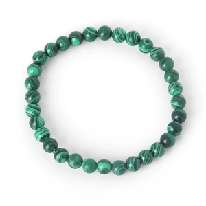 Macro shot of 8mm green malachite beads bracelet showing detailed striped stone texture