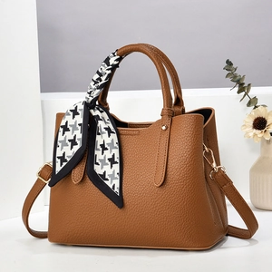 Brown litchi leather handbag with houndstooth silk scarf and gold hardware accents