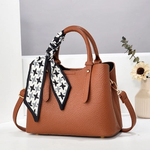 Brown litchi grain tote bag with silk scarf decoration and golden hardware details