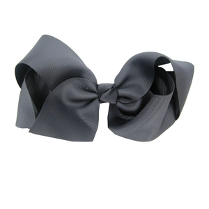 Macro shot of 15cm oversized dark grey fabric hair bow with distinct texture detail