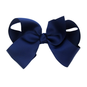 Detailed macro view of dark blue 15cm grosgrain ribbon hair bow for babies