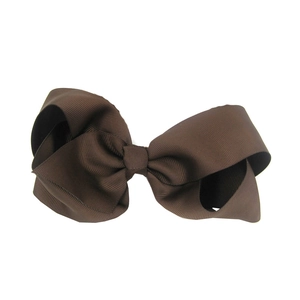 Detailed close-up of a brown 15cm grosgrain ribbon bow hair clip on a white background