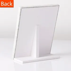 Back view of a white velvet jewelry display stand with a sturdy support bracket