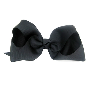 Macro detail of high-quality 15cm black grosgrain ribbon hair bow showing fabric texture