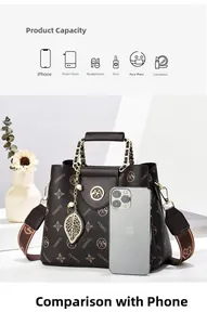 Brown leather crossbody bag size comparison with iPhone showing internal storage capacity