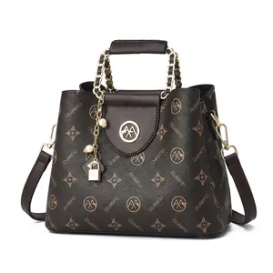 Detailed interior view of brown printed PU leather handbag with multi-pocket layout