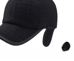 Close-up of winter baseball cap featuring quilted texture and fold-out ear protection