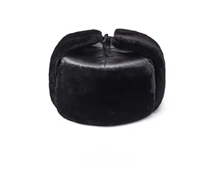 Front view of black winter ushanka hat with glossy leather top and thick faux fur trim