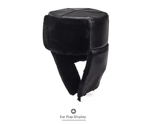 Detail showing high-quality black faux leather finish and thick thermal lining of ear flaps