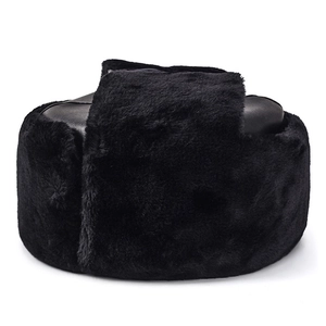 Winter men's black trapper hat with leather top and thick faux fur ear flaps for warmth