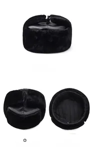 Macro view of quilted lining and faux fur details on black winter aviator trapper hat