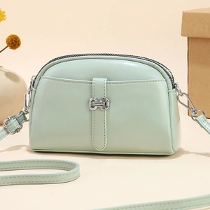 Mint green soft leather mini crossbody bag for women with dual zipper compartments