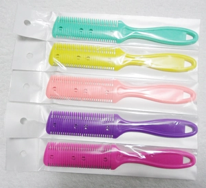 Set of five colorful plastic hair thinning combs in transparent individual packaging