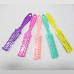 Macro detail of five colorful double-sided hair thinning combs on a white towel background