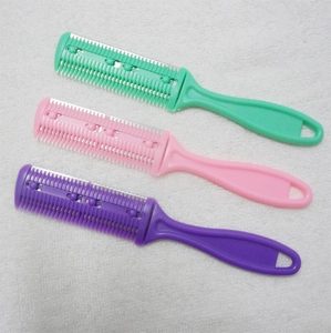 Three-piece hair thinning comb set in green pink and purple on a white towel