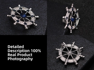 Macro details of silver anchor ship wheel brooch with blue crystals and pin closure