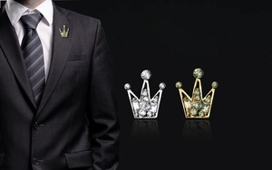 Detail of crown lapel pin brooch for men with sparkling crystal rhinestones set in metal