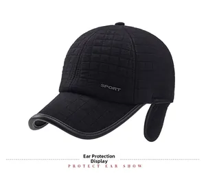 Close-up of black winter baseball cap showing quilted texture and ear protection flaps
