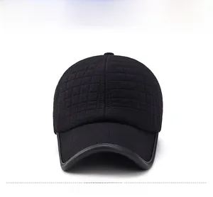 Detail of black winter baseball cap featuring quilted texture and Sport logo badge