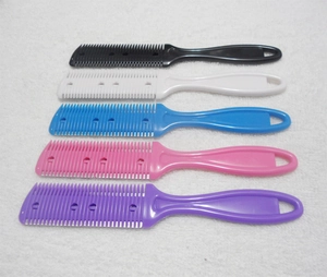 Detail showing five colorful double-sided hair thinning combs on a white towel background