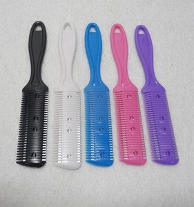 Five colorful double-sided hair thinning combs with blades on white towel