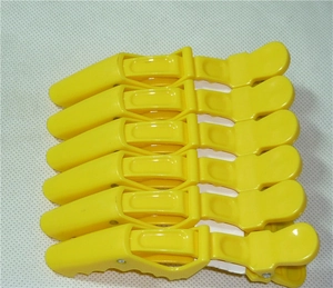 Set of 6 professional yellow plastic crocodile hair clips for salon styling and sectioning