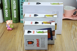 Various sizes of Pinart 3D pin sculpture packaging boxes shown on a wooden desk