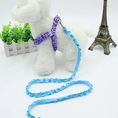 Close-up of purple lace pet harness and blue leash set with durable metal buckle detail