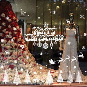 White Christmas window decals with Merry Christmas text, reindeer, and snowflakes