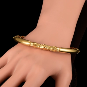 18K gold plated copper pumpkin bracelet for women with elegant embossed design on black background