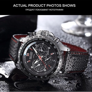 Macro shot of waterproof sport watch with water droplets on black dial and red stitching