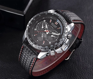 Macro detail of MEGIR sports watch face with chronograph subdials and red-stitched band