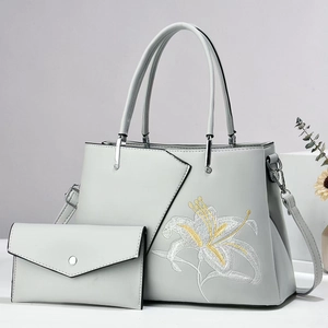 Light blue embroidered tote bag set with lily floral pattern and matching wallet