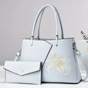 Pastel blue and purple tote bag set with floral embroidery and matching envelope clutch