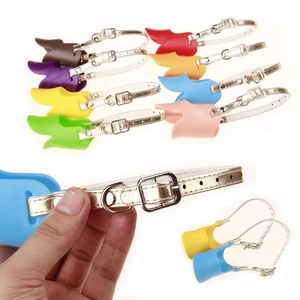 Detail view of multi-colored duck bill dog muzzles with adjustable silicone straps